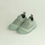  light green slip-on shoes