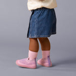 wearing pink shoes