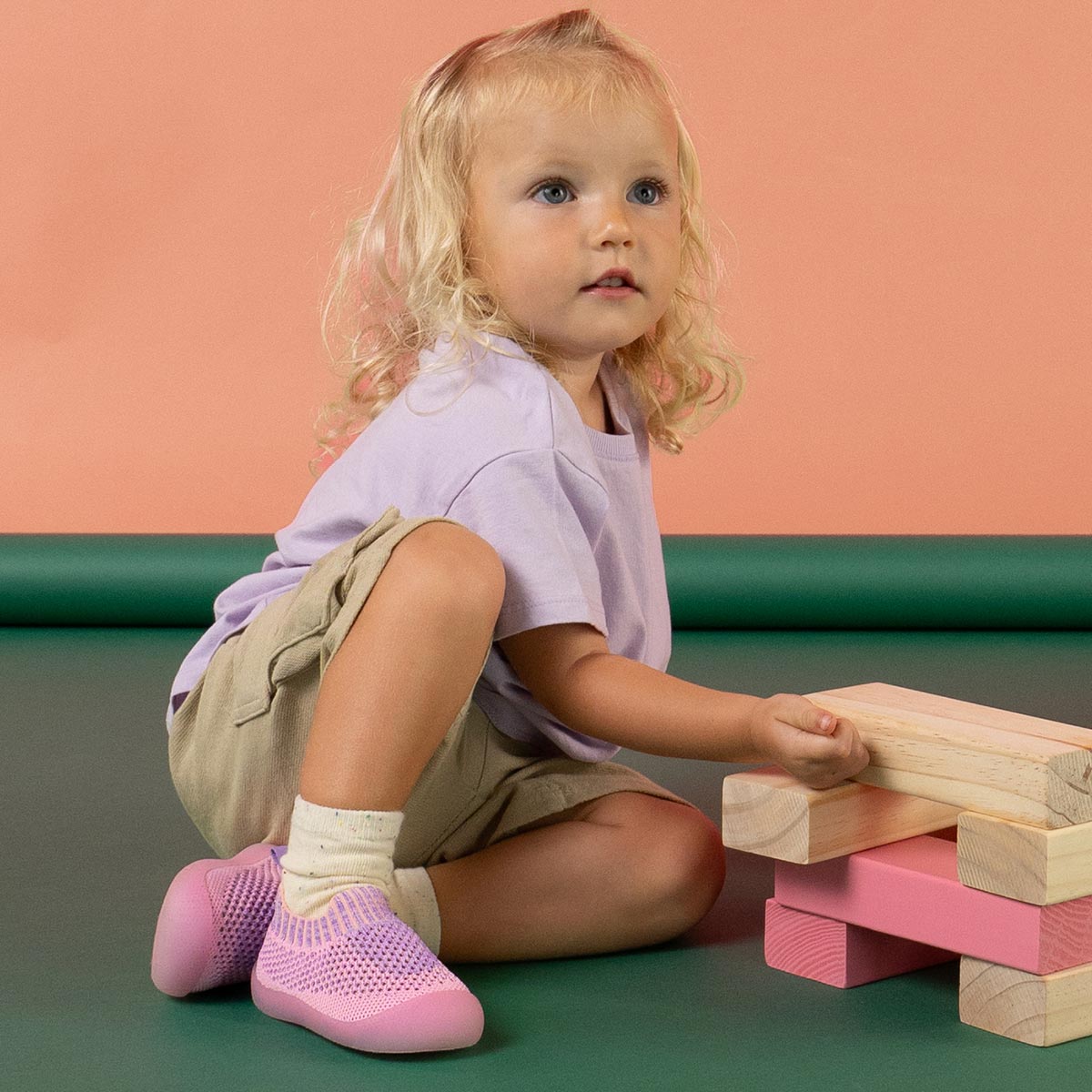 Child playing with wooden block