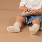 Child wearing white socks