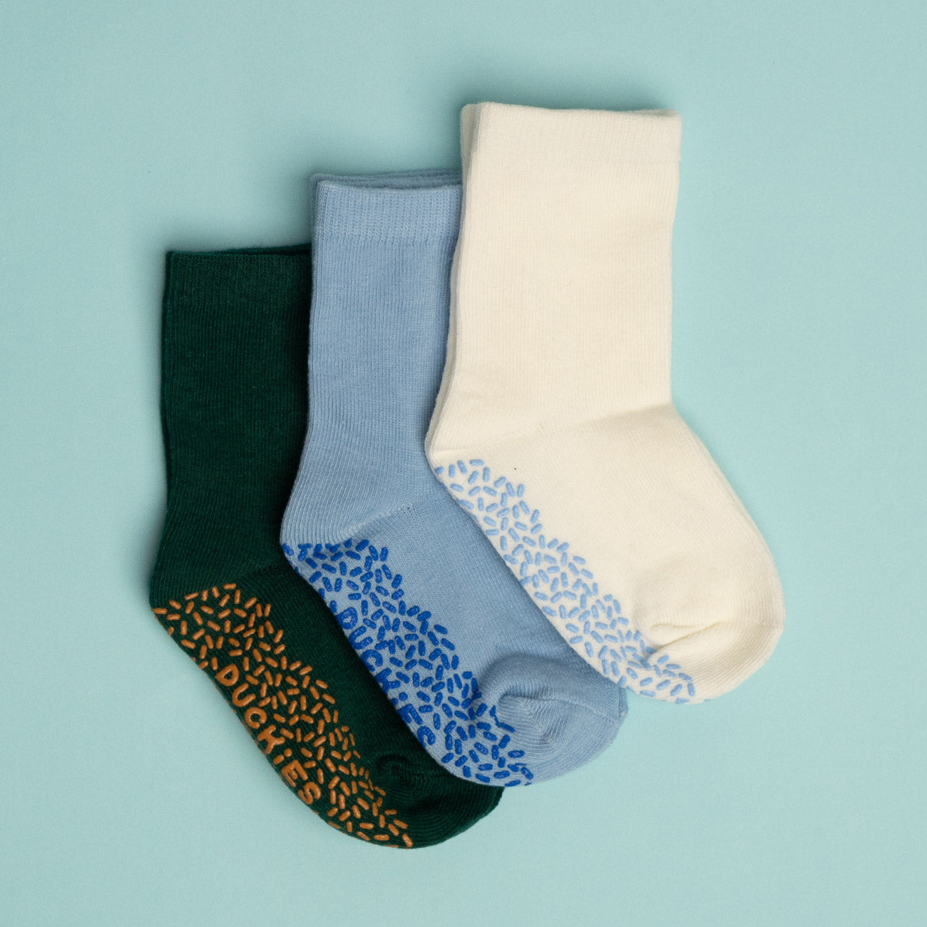 Three pairs of mid-height socks in green