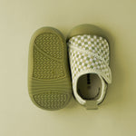 Pair of green baby shoes 