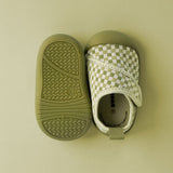 Pair of green baby shoes 