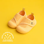 yellow baby shoes