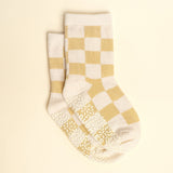 Pair of checkered socks with a beige and white pattern