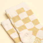 Pair of yellow and white checkered socks