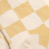 Close-up of a yellow and white checkered fabric pattern