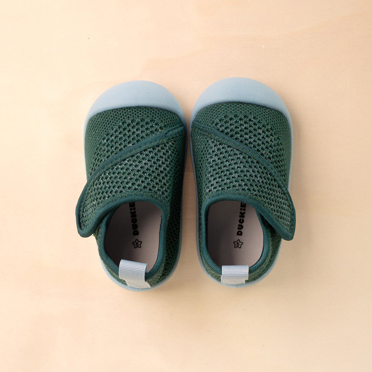 green baby shoes