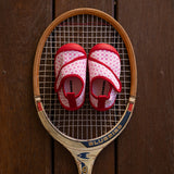 Pink and red baby shoes
